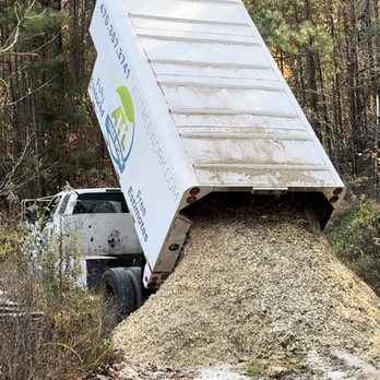 ATL Tree Work - Dump truck dumping wood chips in designated area - Tree Services Near Me - Snellville, Georgia ATL Tree Work - Dump truck dumping wood chips in designated area - Tree Services Near Me - Snellville, Georgia