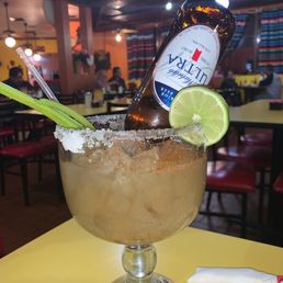 a margarita in a glass with a lime wedge a margarita in a glass with a lime wedge