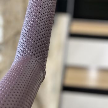 Hide and Stitch - Perforated leather fitted to metal rail in office stair area. - Furniture Stores Near Me - Isleham, CAM Hide and Stitch - Perforated leather fitted to metal rail in office stair area. - Furniture Stores Near Me - Isleham, CAM