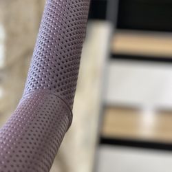 Hide and Stitch - Perforated leather fitted to metal rail in office stair area.