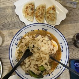Beef noodle soup and 韭菜盒子。 Beef noodle soup and 韭菜盒子。