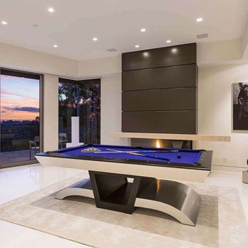Ferrugio Design + Associates - We turned this extra "formal" living area into a gaming parlor and modernized the fireplace with a custom metal shroud and stone mantle. - Interior Design Near Me Ferrugio Design + Associates - We turned this extra "formal" living area into a gaming parlor and modernized the fireplace with a custom metal shroud and stone mantle. - Interior Design Near Me
