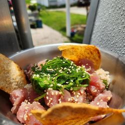 Farmstead Refreshments - Fresh Poke Served Over Rice and Topped With A Garnish Of Seaweed Salad and Gluten Free Corn Chips