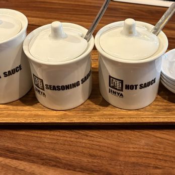 JINYA Ramen Bar - Chandler - Condiments at the table - Ramen Near Me - Chandler, Arizona JINYA Ramen Bar - Chandler - Condiments at the table - Ramen Near Me - Chandler, Arizona