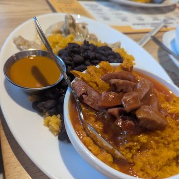 Brasa Rotisserie - Smothered chicken plate with yams and andouille - Southern Near Me - Saint Paul, Minnesota Brasa Rotisserie - Smothered chicken plate with yams and andouille - Southern Near Me - Saint Paul, Minnesota