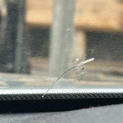 Southland Body & Paint Shop - The crack that the OWNER put in my windshield.