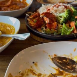 Butter Chicken, Paneer Sizzling Platter, Chicken Qorma and empty plates. Delicious! Butter Chicken, Paneer Sizzling Platter, Chicken Qorma and empty plates. Delicious!