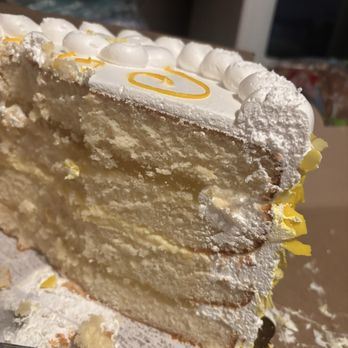 Village Baking Company & Cafe - White cake with lemon and custard filling - Bakeries Near Me - Modesto, California Village Baking Company & Cafe - White cake with lemon and custard filling - Bakeries Near Me - Modesto, California