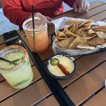 Condado Tacos - House, strawberry, and jalapeño margarita with queso and chips - Tacos Near Me - Mount Pleasant, South Carolina