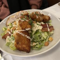 Chicken Caesar salad with poulette.