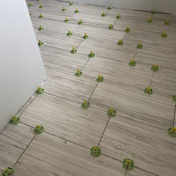 Premier Building Group - Tile Floor in one of our Bathroom Remodels, using our Tile Level System - Carpenters Near Me - West Milton , Ohio Premier Building Group - Tile Floor in one of our Bathroom Remodels, using our Tile Level System - Carpenters Near Me - West Milton , Ohio