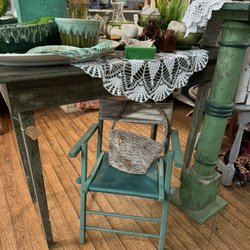 Marina Marina - Child's lawn chair, green plant stand and green work table or desk.