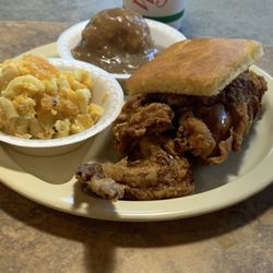 Fried chicken (White meat), mac and cheese, rice and gravy with a piece of cornbread.