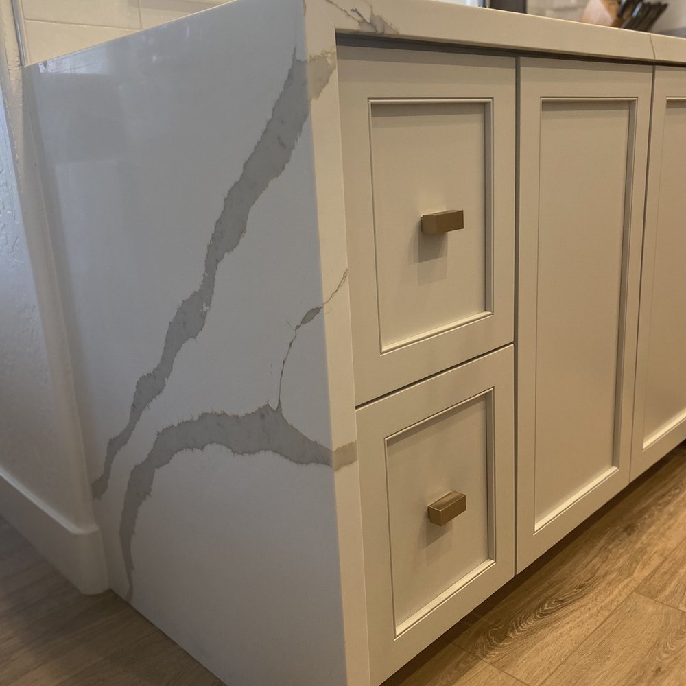 ECT Marble And Granite - Waterfall edge with mitered matching veining - Countertop Installation Near Me - Mesa, Arizona ECT Marble And Granite - Waterfall edge with mitered matching veining - Countertop Installation Near Me - Mesa, Arizona
