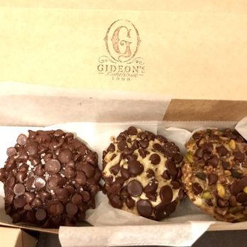 Gideon's Bakehouse - Giant cookies! Triple Chocolate Chip, Classic Chocolate Chip, and Pistachio Toffee Dark Chocolate - Bakeries Near Me - Orlando, Florida