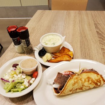 Olga's Fresh Grille - two plates of food on a table - Mediterranean Near Me - Comstock Park, Michigan