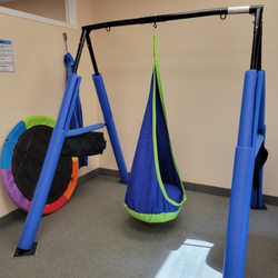 Stewart SLP - Stewart SLP uses swings for regulation and fun during therapy!