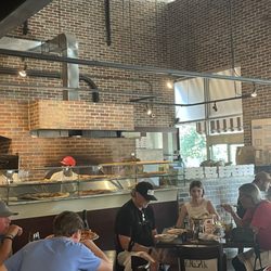 Tony C's - A view of the kitchen where you can see them preparing pizzas. It's to the right of the entrance.