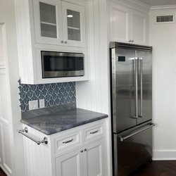 HHI - Orange County water damage repair with new cabinetry, flooring, and appliances