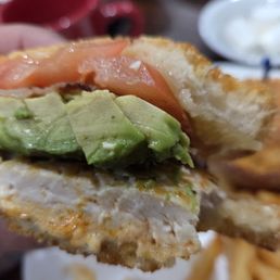 Here is the Ultimate Sandwich with grilled chicken. Bacon, avocado and tomatoes. The bread was grilled with melted cheese.