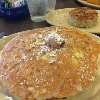Snooze, an A.M. Eatery - Huge stack of pancakes and a cylinder of hash browns. - Breakfast & Brunch Near Me - Centennial, Colorado