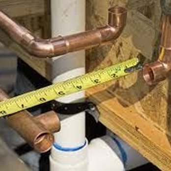 JP Construction & Estimating Services - a measuring tape on a pipe - Plumbing Near Me JP Construction & Estimating Services - a measuring tape on a pipe - Plumbing Near Me
