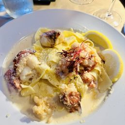 Poached lobster Alfredo over pappardelle noodles. Absolutely delicious!