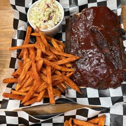 Half rack of baby back ribs + sweet potato fries + coleslaw Half rack of baby back ribs + sweet potato fries + coleslaw