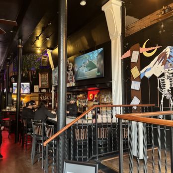 Vindicktive Wings - a bar with a skeleton on the wall - Chicken Wings Near Me - Seattle, Washington Vindicktive Wings - a bar with a skeleton on the wall - Chicken Wings Near Me - Seattle, Washington