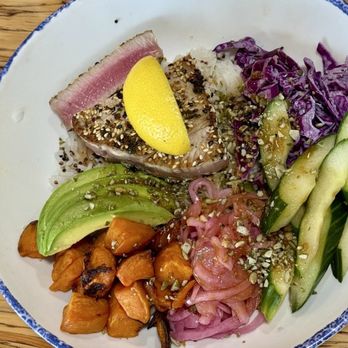 Slapfish - Bowl with ahi tuna: ahi was overcooked (slice shown was OK, much more done inside. Sweet potatoes a nice touch! - A seafood bowl with tuna, avocado, cucumber, purple cabbage, pickled onions, and roasted sweet potatoes, garnished with a lemon wedge. - Seafood Near Me - Albuquerque, New Mexico