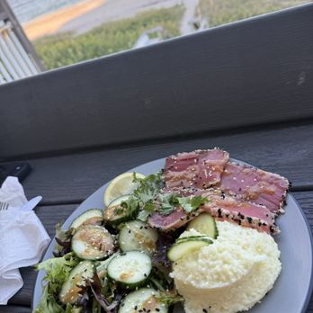 Sand On the Beach - Tuna medallions with grits and a small salad - American Near Me - Melbourne Beach, Florida Sand On the Beach - Tuna medallions with grits and a small salad - American Near Me - Melbourne Beach, Florida