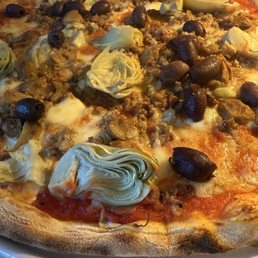 Sausage and artichoke pizza. Sausage and artichoke pizza.