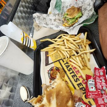 Carl's Jr - Carl's Jr Bacon Burger with onion rings in it - Burgers Near Me - Honolulu, Hawaii