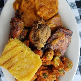 Jerk chicken small with corn bread candied yams and fried okra
