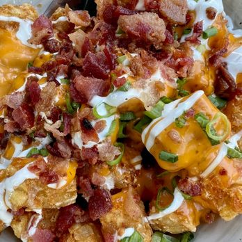 Delafield Brewhaus - LOADED TOTS Seasoned tots, queso sauce, sour cream drizzle, crisp bacon bits, and onion. Add Jalapenos. - Pubs Near Me - Delafield, Wisconsin