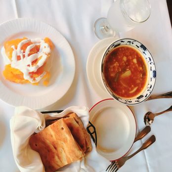 The Helmand - Kaddo borwani (upper left), fresh naan (lower left), Shorwa Soup (right) - Afghan Near Me - Baltimore, Maryland The Helmand - Kaddo borwani (upper left), fresh naan (lower left), Shorwa Soup (right) - Afghan Near Me - Baltimore, Maryland