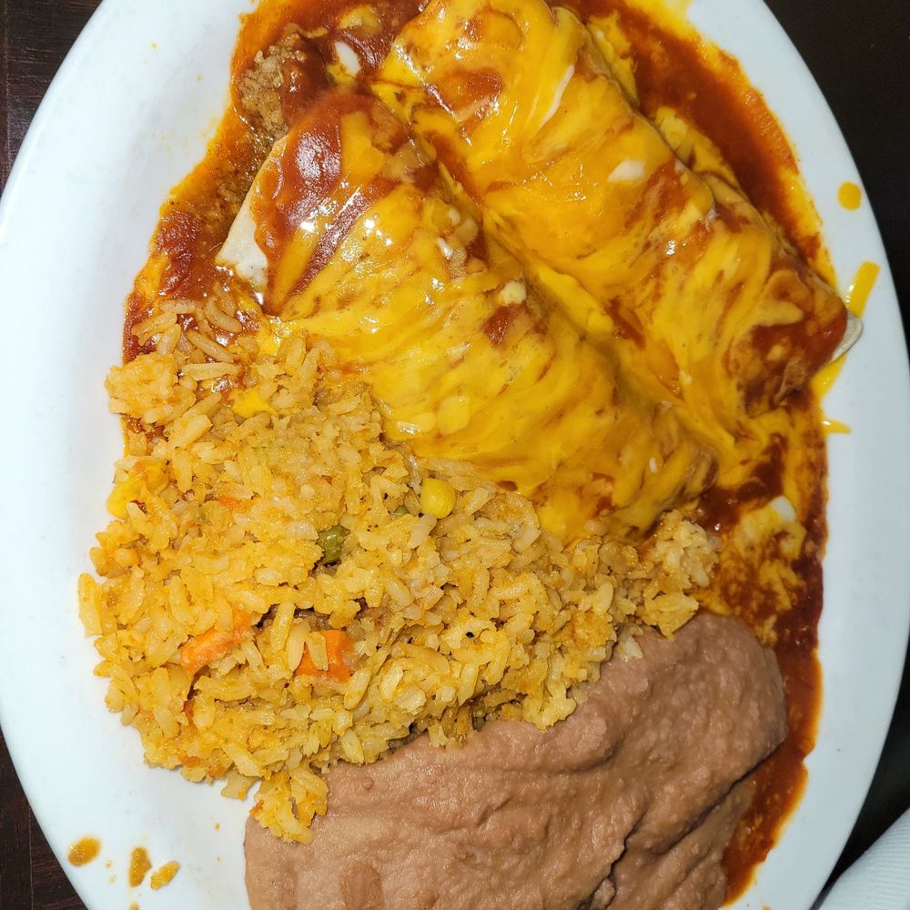 Beef enchiladas, rice and beans, good. Beef enchiladas, rice and beans, good.
