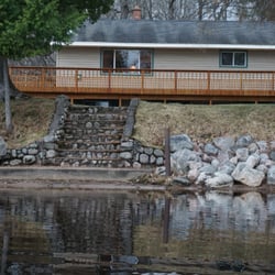 Musky Point Resort - Main house with access to Lake of the Falls sandy shores (just beyond the boulders...its soft sand :)