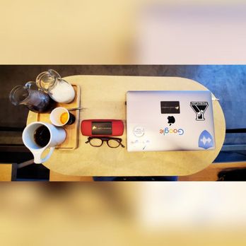 Intelligentsia Coffee - a desk with a laptop and a cup of coffee - Coffee & Tea Near Me - Austin, Texas Intelligentsia Coffee - a desk with a laptop and a cup of coffee - Coffee & Tea Near Me - Austin, Texas