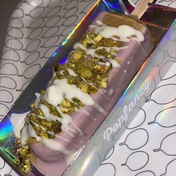 Popfancy Dessert Bar - Vietnamese Coffee popsicle dipped in taro, with pistachios and white chocolate drizzled on top. - Desserts Near Me - Houston, Texas Popfancy Dessert Bar - Vietnamese Coffee popsicle dipped in taro, with pistachios and white chocolate drizzled on top. - Desserts Near Me - Houston, Texas