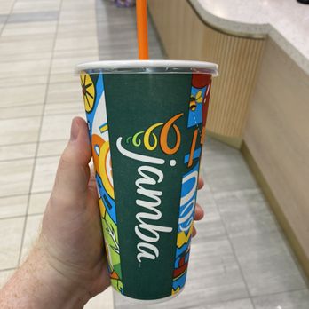 Jamba - a hand holding a paper cup with a straw - Juice Bars & Smoothies Near Me - Burlington, Massachusetts Jamba - a hand holding a paper cup with a straw - Juice Bars & Smoothies Near Me - Burlington, Massachusetts