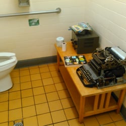 Rebel Drive Inn Restaurant - Men's bathroom with interacting radio and typewriter ( what's a typewriter??? ) in it.