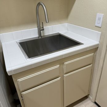 The Groutsmith - Restored tile countertops in laundry room. - Grout Services Near Me - San Marcos, California The Groutsmith - Restored tile countertops in laundry room. - Grout Services Near Me - San Marcos, California