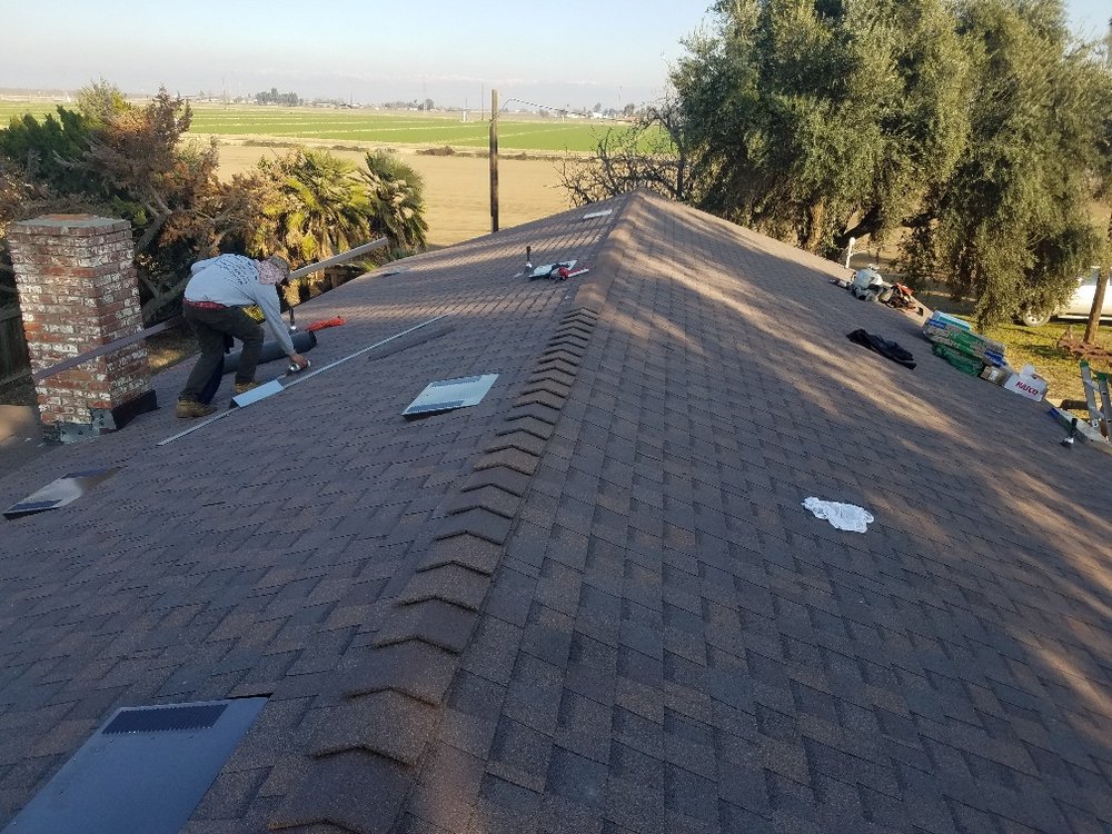 Slide of Efrain Zepeda's Rainbow Roofing