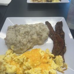 Honey I'm Home - Biscuits and Gravy with peppered bacon and eggs.