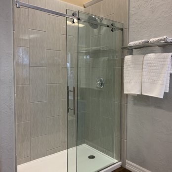 Re-Bath - a shower with a glass door - Kitchen & Bath Near Me - Lubbock, Texas