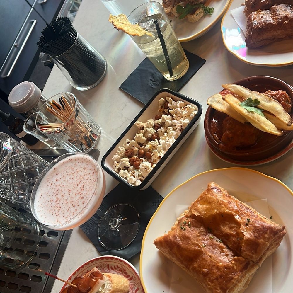 Galician Style Empanada, calamari's Fritos, montadito de salmon lomo, Spanish meatballs, la mami cocktail and ananas jaibol cocktail