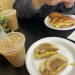 Brown sugar cinnamon ice coffee and egg and cheese sandwiches with Italian sausage