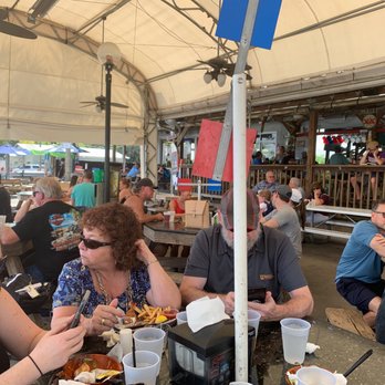 Rick's On the River - Outdoor seating area - packed for lunch midday on a Friday! - New American Near Me - Tampa, Florida Rick's On the River - Outdoor seating area - packed for lunch midday on a Friday! - New American Near Me - Tampa, Florida