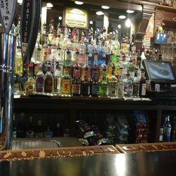 Dively's Tavern - The above bar liquor selection and register area